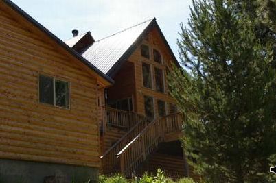 Looking at West face of house and garage